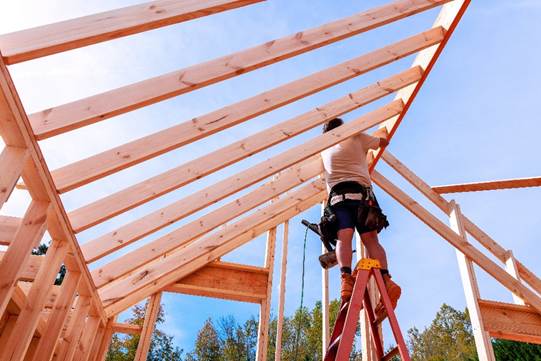 Framing crew building a new roof structure on a Connecticut home